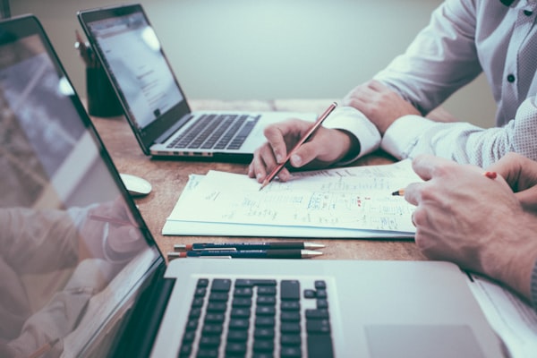 Professionals working on accounting documents